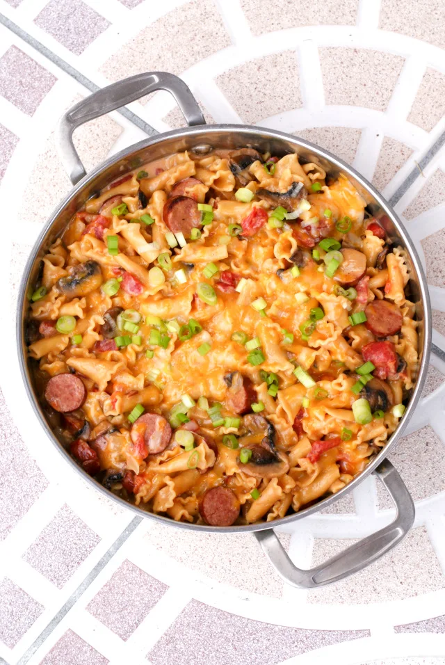 One Pot Cheesy Kielbasa Pasta is an easy to make skillet meal that that features lean turkey kielbasa, pasta, veggies, and lots of melty cheese.  The best part is that it all cooks in just one pot!