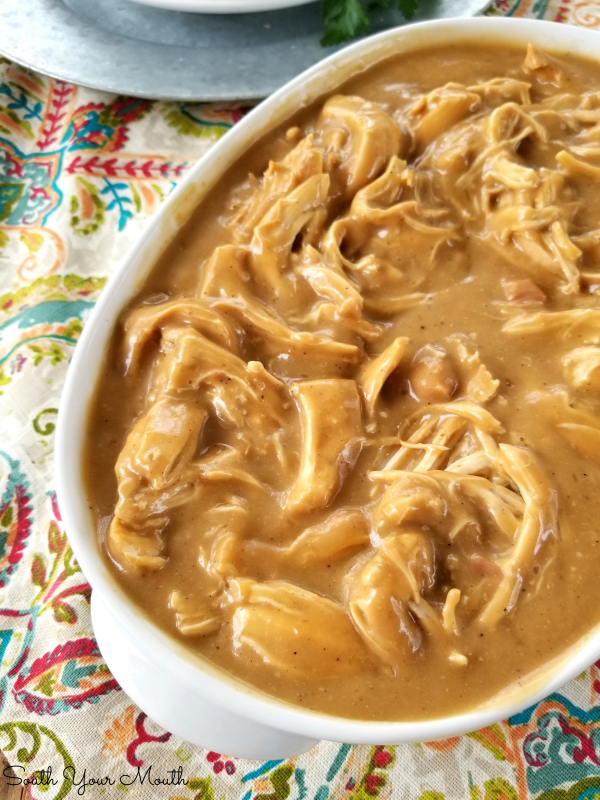 Crock Pot Chicken & Gravy | An easy and delicious slow cooker recipe for tender chicken with savory gravy perfect served over mashed potatoes, noodles or rice.
