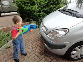 Big Boy Washing the Car with a Water Gun