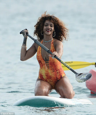 Divaparrots Weekly Rihanna Shows Off Her Curves In A Flame Inspired
