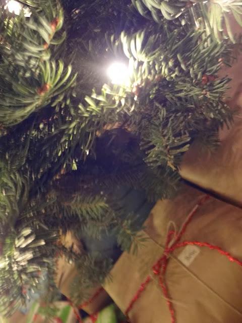 Presents under a tree, wrapped in brown parcel paper