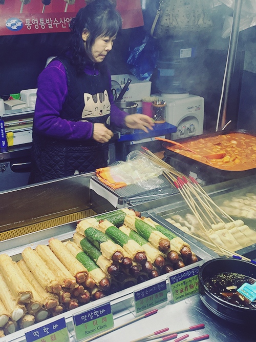 The area surrounding our hotel was filled with stalls selling breads, hotteok, sweet potatoes, and sausages wrapped in all these things. Choui-ro, Jung-gu, Seoul, South Korea. 29 December 2015.