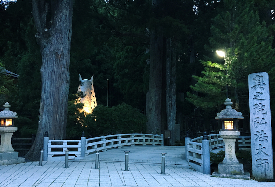 Koyasan Japan Okunoin Cemetery entrance gate dusk A dimly illuminated entrance of Okunoin Cemetery Koyasan Japan