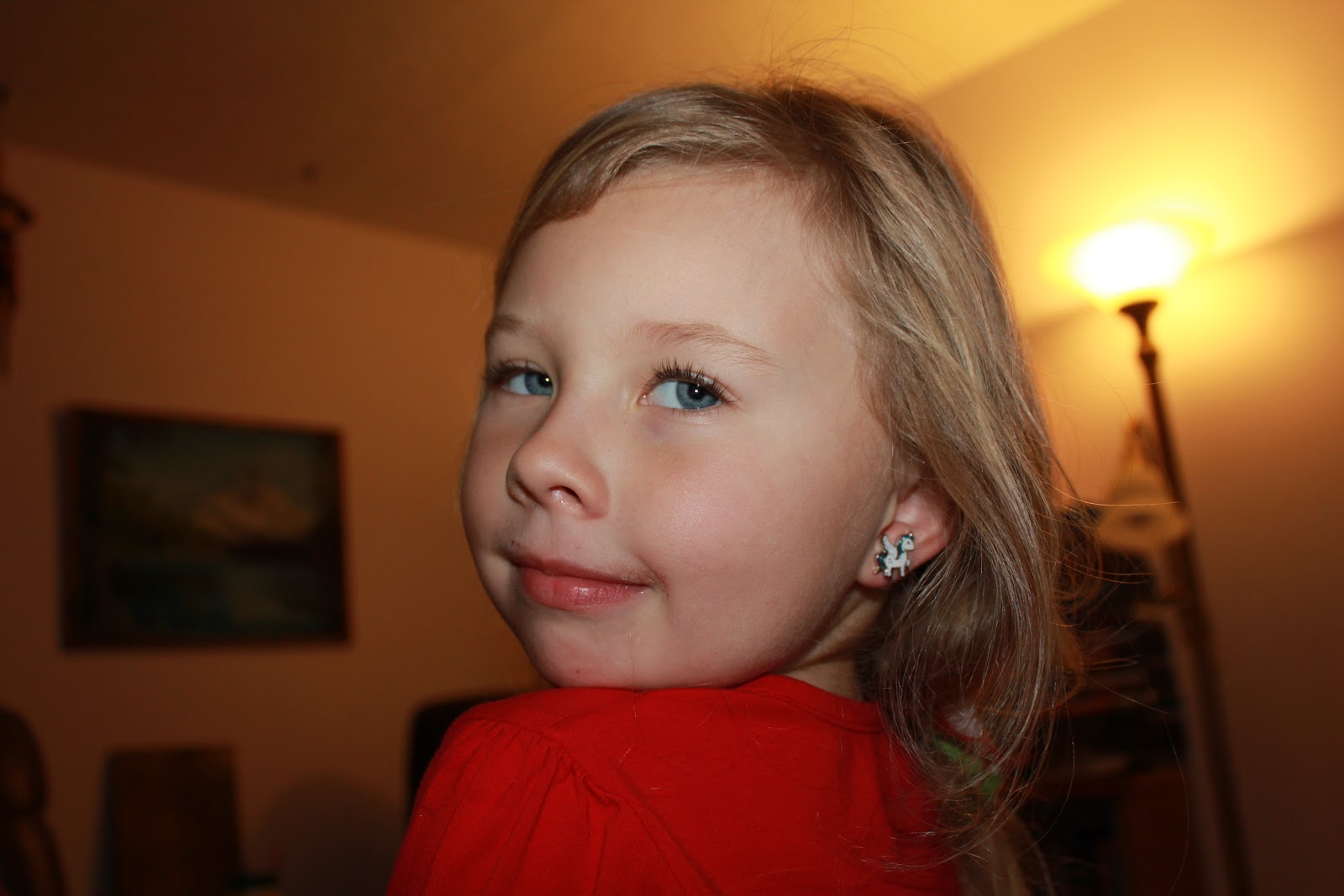 Gracie showing off her unicorn earrings - this is such a model pose - ha! 