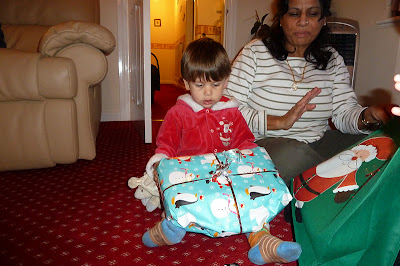 Child opening Christmas presents