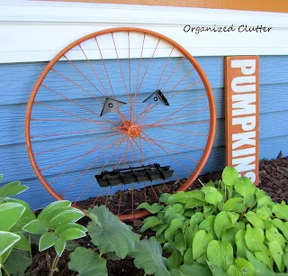 Repurposed Bicycle Wheel Jack o'Lantern www.organizedclutterqueen.blogspot.com