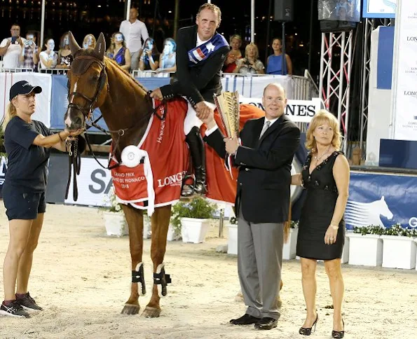 Prince Albert of Monaco and Charlotte Casiraghi attended award ceremony of Monaco Longines Global Champions Tour 2018. Charlotte wore Gucci dress