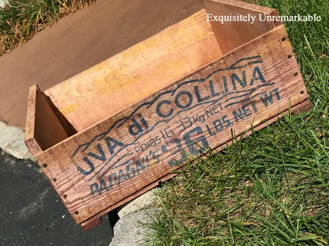 Wooden Crate Makeover that has been stained on a patio