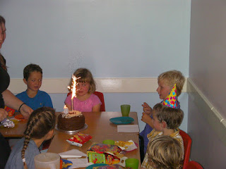 birthday girl with cake and candle at krazy kaves