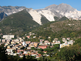 The mountains around Carrara sometimes appear to be covered in snow even in summer