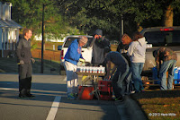 The Wakulla High School cross-country team sets up a water table on Biltmore Avenue for Gulf Winds Track Club's 2013 Tallahassee Turkey Trot 15K Wakulla High School cross-country team