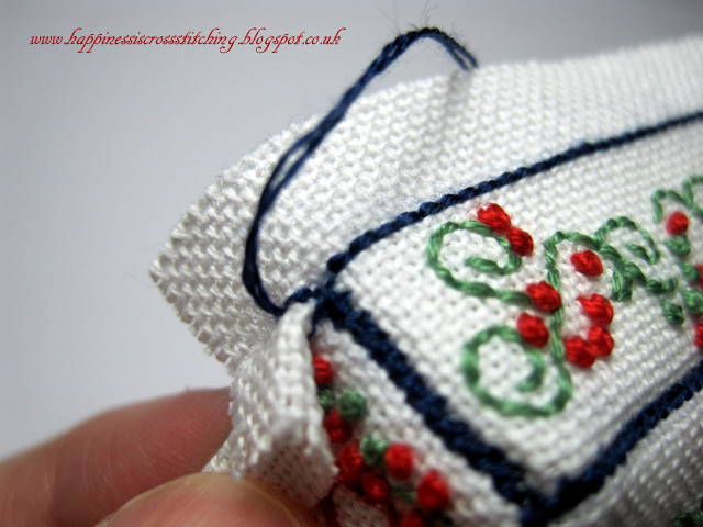 Cross stitched cottage with french knots a tutorial showing how to finish into a mattress pincushion