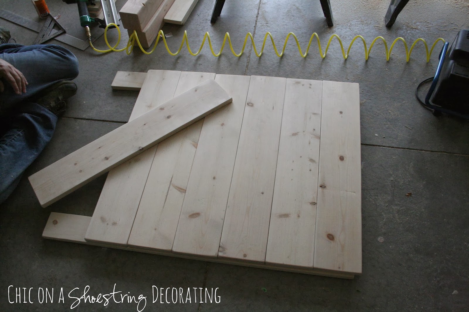 How to Build a Rustic, Wooden Headboard with an attached light fixture. Headboard Tutorial by Chic on a Shoestring Decorating.