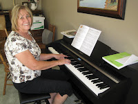 woman happy playing learning digital piano