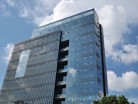 clouds reflecting off a building in Zhongshan, China