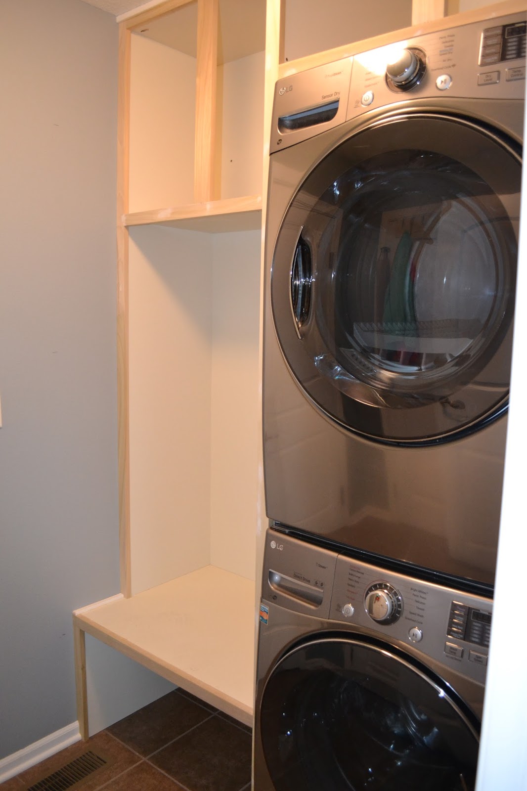 Ryan, Janelle, Kayson & Cora Laundry Room to "Laundry & Drop Room"