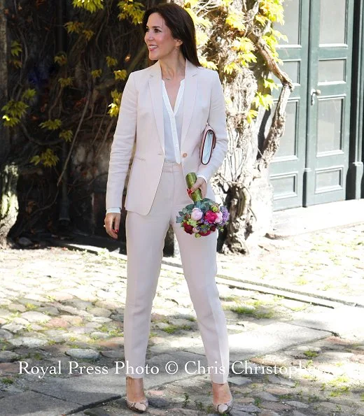 Crown Princess Mary wore beige Massimo Dutti pantSuit and Gianvito Rossi python pumps.