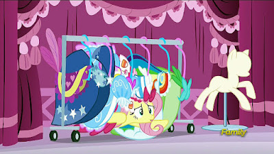 Fluttershy hides among the Gala dresses