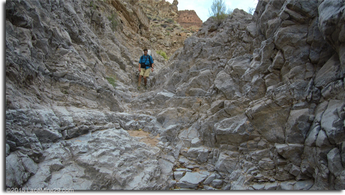 Ultralight backpacker hiking down stone