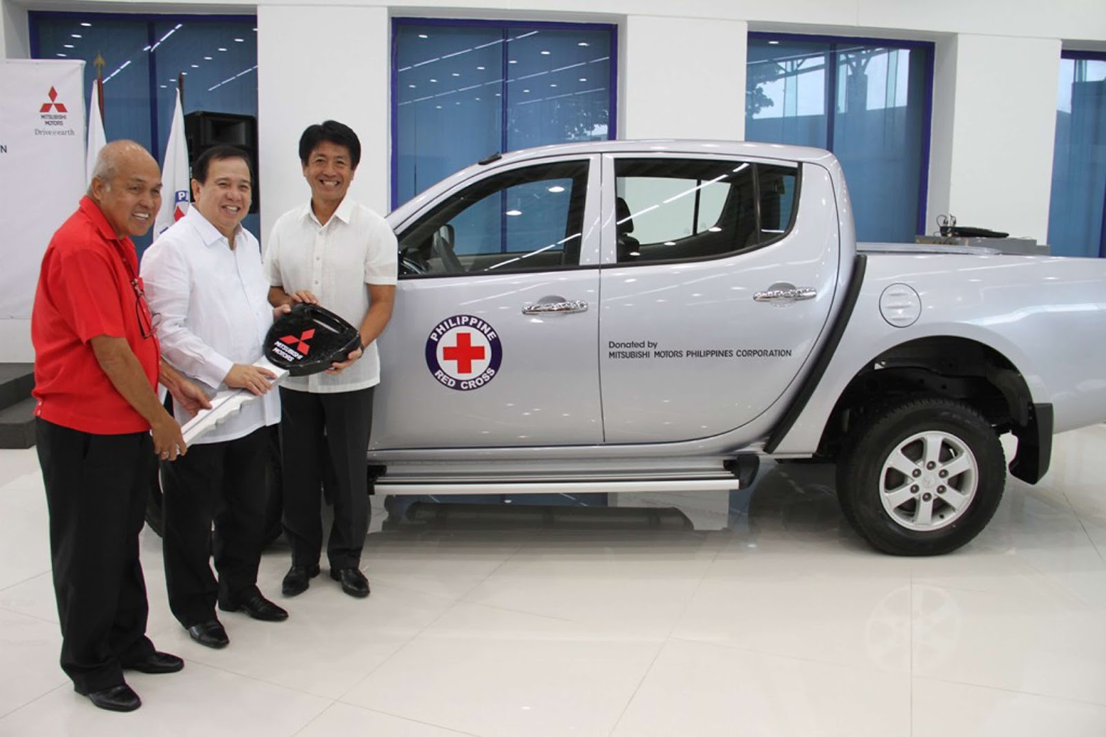 From Left to Right: Mr. Jaime Ching - Philippine Red Cross - Laguna Chapter Chairman of the Board, Senator Richard Gordon - Philippine Red Cross Chairman and Mr. Yoshiaki Kato, Mitsubishi Motors Philippines Corporation (MMPC) President and CEO Mitsubishi Motors Philippines donates a brand new Strada to Philippine Red Cross