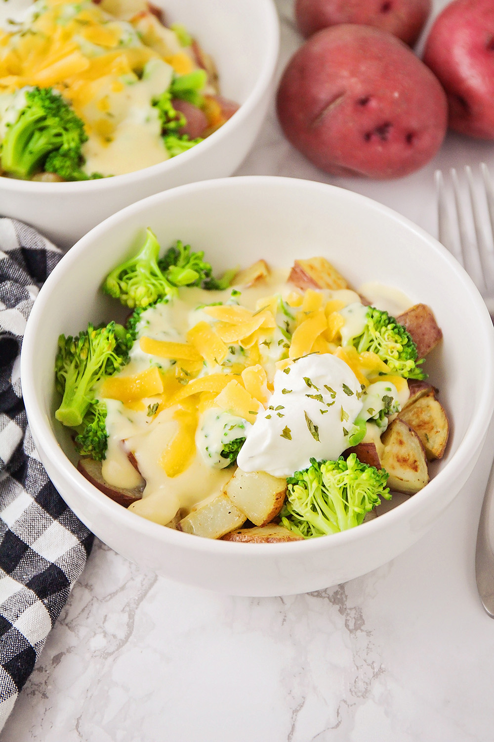 These cheesy broccoli potato bowls are a delicious meatless meal that's easy to make and perfect for a busy weeknight!