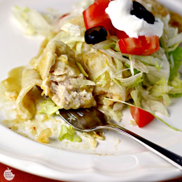 Cheesy Chicken Enchiladas Verde | by Renee's Kitchen Adventures - an easy dinner or lunch recipe for chicken enchiladas in green chili sauce with lots of CHEESE! 