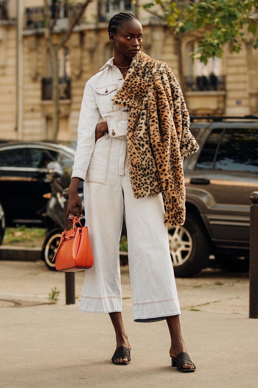 Spring Outfit Idea — White Jumpsuit, Leopard-Print Coat, Orange Bag, and Black Sandals