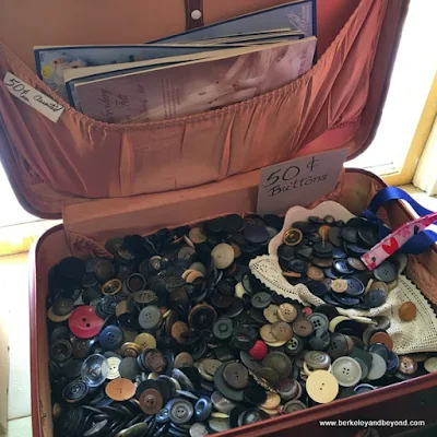 suitcase full of buttons at Columbia Kate’s Boutique in Columbia SHP, California