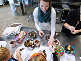 Troop leader helping in the Kitchen with Girl Scouts of North East Ohio