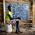 Nyayang, 10, doesn’t have a chair to sit on in class in South Sudan.