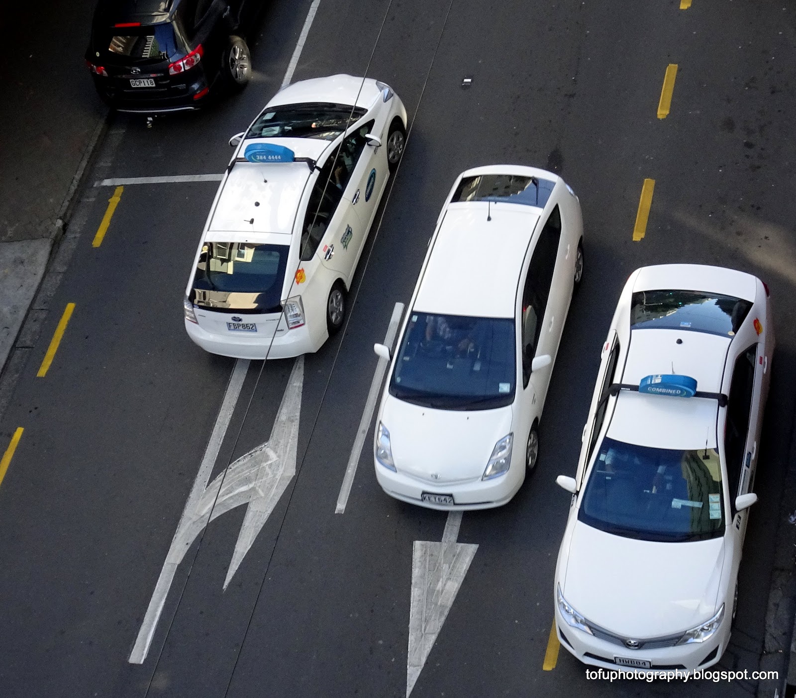 Tofu Photography Taxis and cars in a street in Wellington, New Zealand