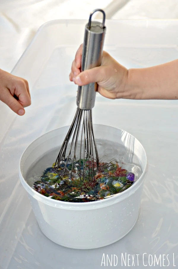 Fine motor practice for toddlers and preschoolers with a simple water sensory bin from And Next Comes L