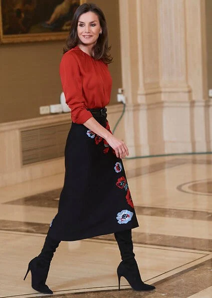 Queen Letizia wore Hugo Boss Banora red gathered neck silk blouse and Carolina Herrera black poppy-print knit skirt, gold diamond earrings
