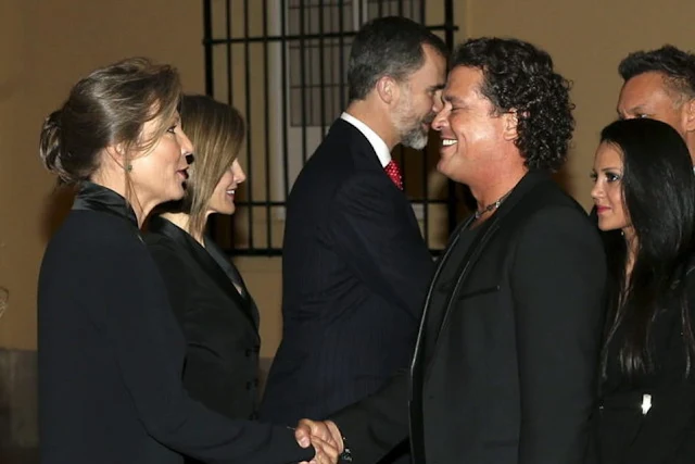 Colombian singer Carlos Vives greets Maria Clemencia Rodriguez, wife of Colombian President Juan Manuel Santos next to Spanish King's Felipe VI and Queen Letizia during the official reception of a dinner held at El Pardo Palace in Madrid, Spain