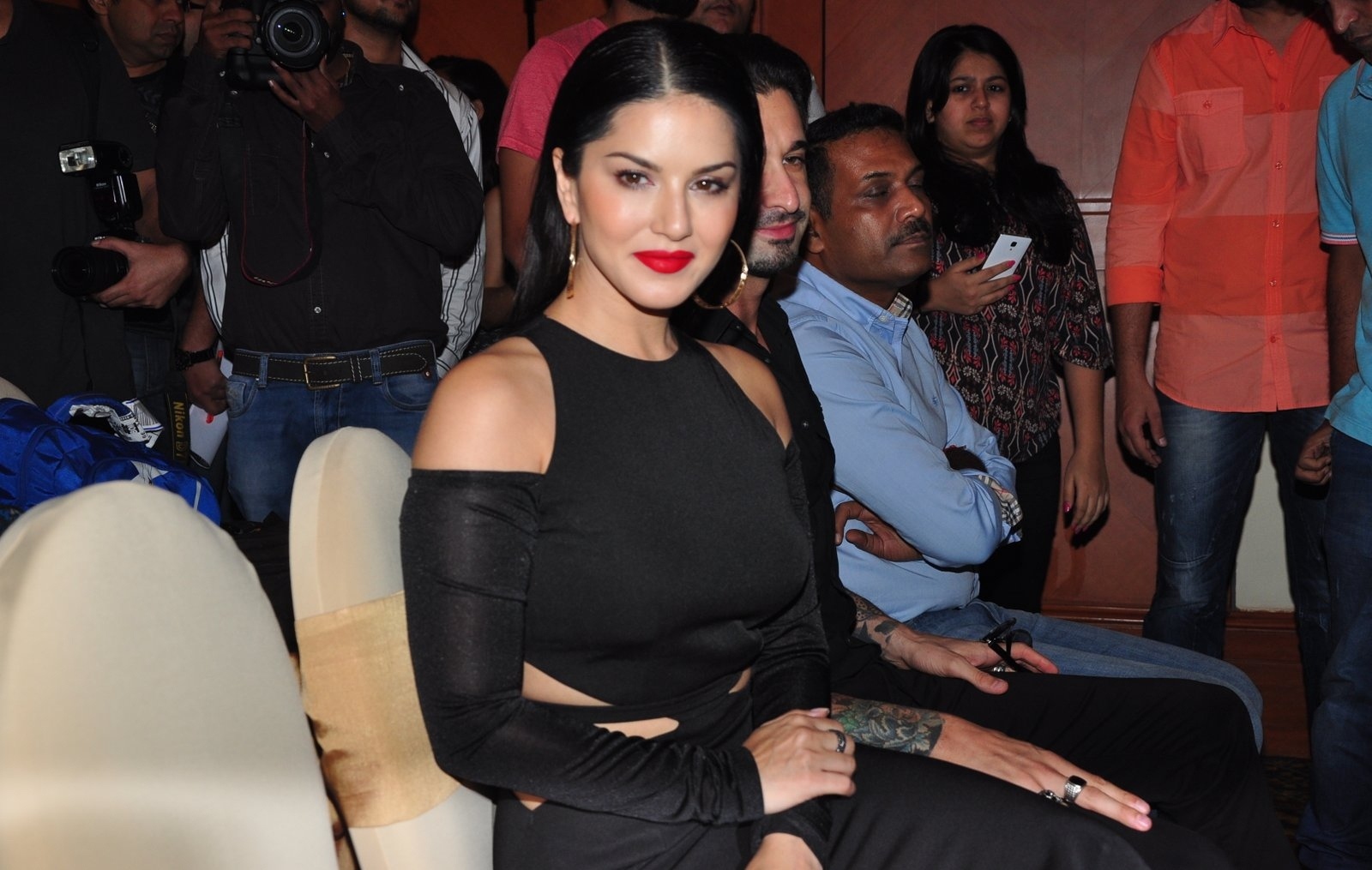 Sunny Leone Showcasing Her Sexy Curves in a Black Figure Hugging Dress At The Manforce Calendar Launch Event in Mumbai
