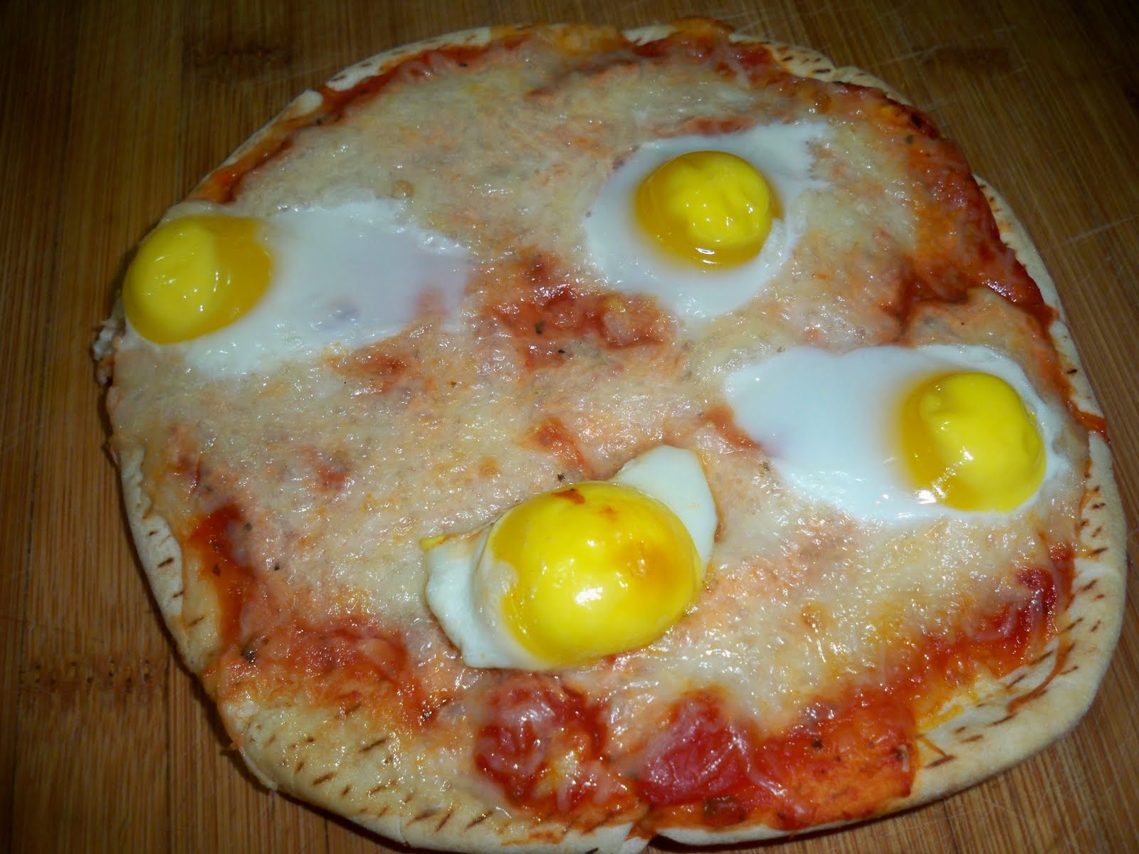 Sweet Coconut and Cumin Fita Pizza with quail eggs
