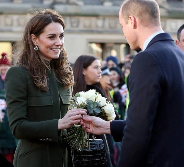 Kate Middleton wore a green Alexander McQueen coat, a print dress by Zara, Zeen ceramic earrings and Aspinal of London Mayfair bag