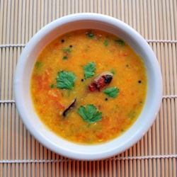 Tomato Dal soup filled with curry spices Ginger, mustard seeds, asafetida, chili powder, chili peppers, turmeric, serranos 