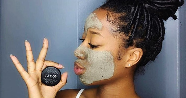 Woman using Black-owned skincare products