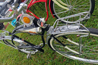 Bicycle with many accessories and white-wall tires.