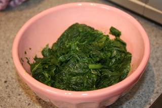 frozen spinach defrosting and cooked, wilted spinach