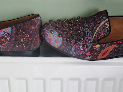 close up of paisley shoes with pewter studs