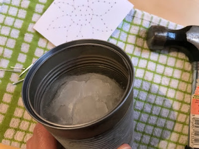 Freezing water in cans to make tin can lanterns