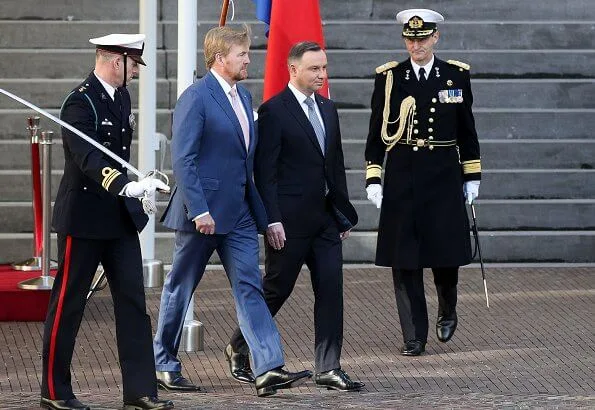 Queen Maxima and First Lady Agata Kornhauser-Duda attended the lunch at Royal Palace. She wore a red wool coat by Natan