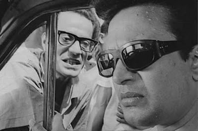 Uttam Kumar as Arindam Mukherjee in Satyajit Ray's Nayak: The Hero, driving car, with friend Biresh