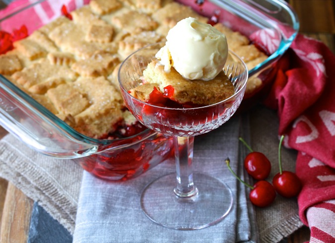 This Cherry Cobbler with a Sugar Cookie Crust is so delicious served warm and topped with vanilla ice cream. 