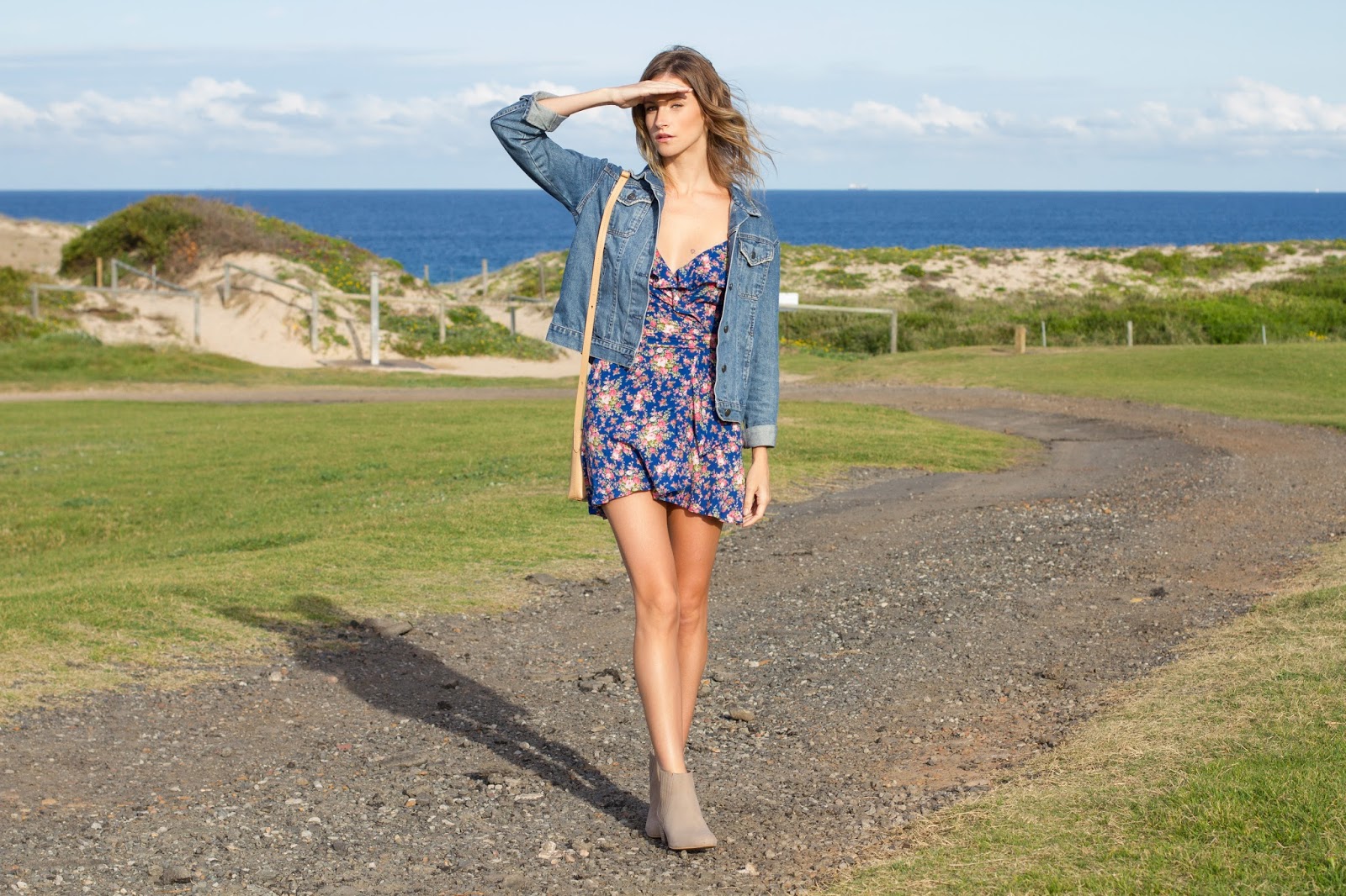 fashion blogger and designer, Alison Hutchinson, is wearing a KAYVALYA blue floral wrap dress, Topshop denim jacket, and Witchery nude suede ankle boots