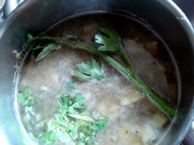 soup with celery and parsley leaves
