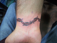 Barb wire tattoo designs,wrist tattoo designs