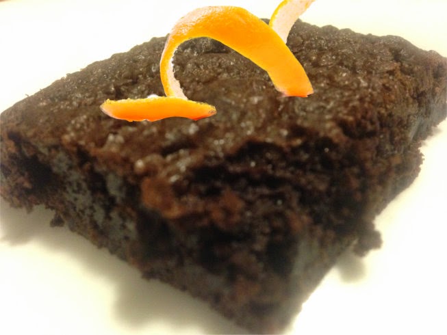 chocolate brownie with an orange peel curlique on top